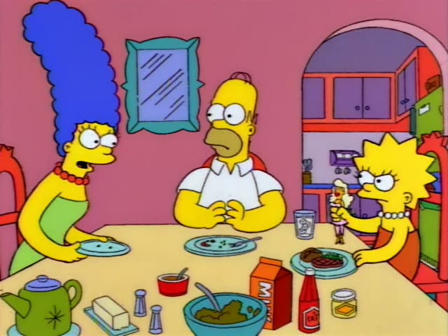 Marge, with her tall blue beehive and green dress, Homer in his white shirt, and Lisa in her red dress and pearls sit…