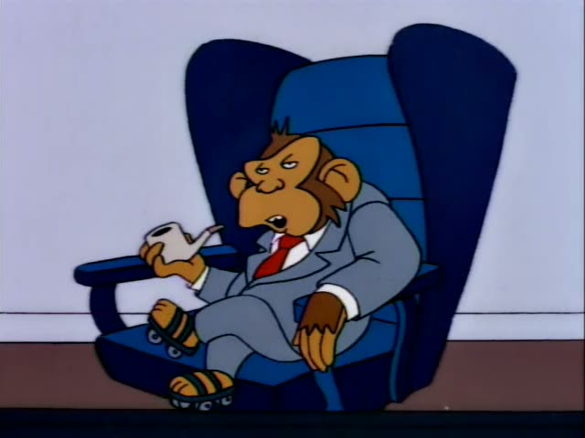 A monkey in a grey suit, red tie and roller-skate sandals sits in a tall blue armchair, first holding a cup, then a pipe…
