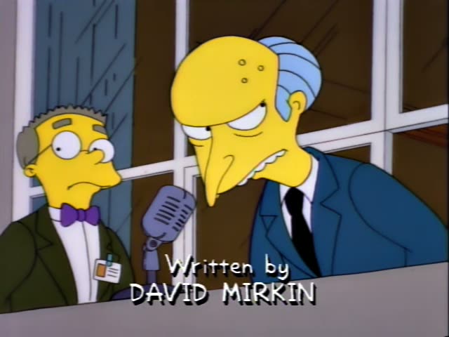 Mr. Burns stands at a microphone beside his thin assistant Smithers, who wears glasses, a bow tie and an ID badge