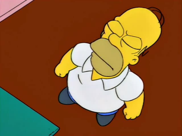 Homer Simpson and Marge Simpson stand in a pink-walled room with a brown floor and a teal rug