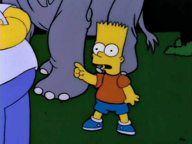 Homer stands on a grassy lawn in front of a large grey elephant, with Marge, Lisa and Bart nearby