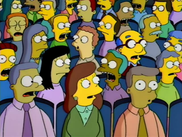 Dozens of Springfield residents, including Mrs. Krabappel with her tall brown hairdo in a green top at the front centre…