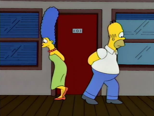 Marge and Homer stand in a hallway beside a red door marked 101, first facing away, then turning to a thin, stooped old man…