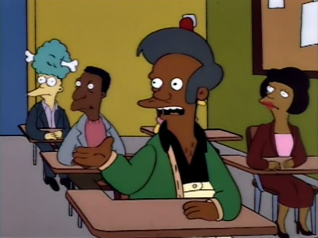 Apu gestures and speaks at the front of a classroom, with Carl beside him and a teal-haired figure and a woman in a maroon…