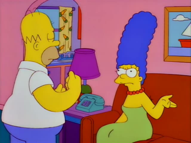 Homer and Marge are in the family living room