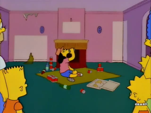 Homer, Bart, Lisa and Marge stand in a pink living room with a fireplace, watching a woman with long dark curly hair, a pink…