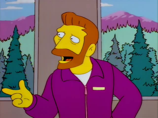 Homer stands beside a bearded man with ginger hair in a purple zip-up jacket, who is not one of the regulars and is…