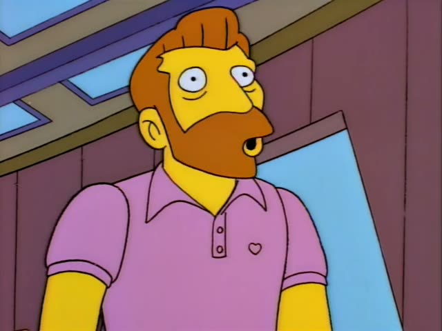 Homer Simpson stands small at the left of a room with wood-paneled walls and tall blue glass panels, while a ginger-bearded…