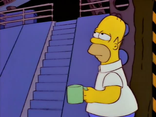 Homer stands near a staircase holding a green mug while a reddish-haired man with swept-back hair, a blue jacket and a pink…