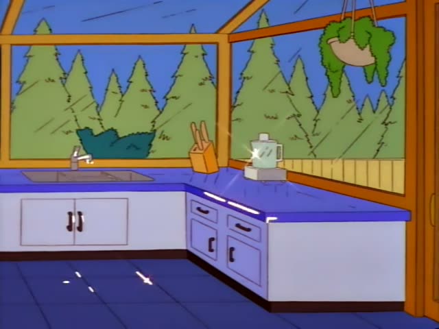 Marge Simpson stands at a blue kitchen counter in a wooden cabin kitchen with pine trees visible through the windows