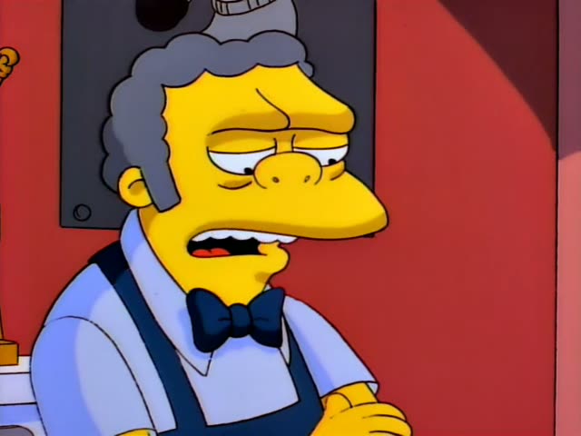 Moe stands behind the bar with a sour, tight-lipped expression, then talks and gestures with one hand