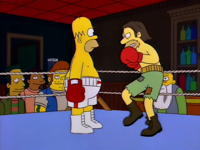 Homer boxes a scruffy long-haired man in ragged green shorts and black boots inside a boxing ring in a bar, while a crowd…
