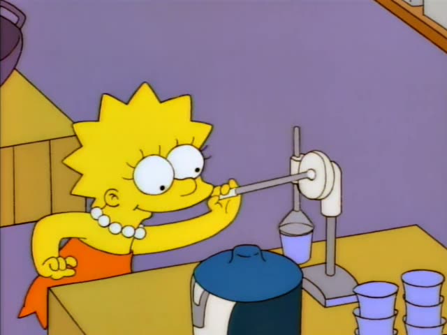 Lisa stands at a counter in a lavender kitchen working a lab stand with a glass funnel and a clamp, while Bart stands…