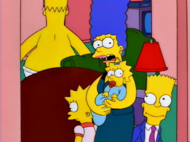 Marge with her tall blue beehive holds baby Maggie, who has a pacifier and blue bow, while Lisa in her red dress and Bart…