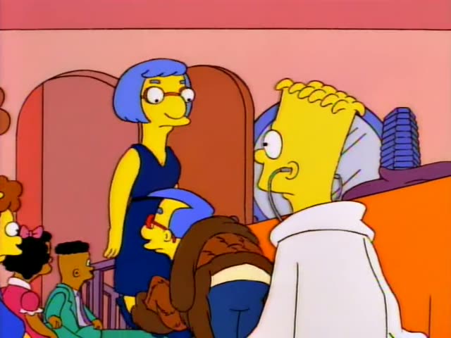 Milhouse sits beside Bart, who wears a white lab coat and stethoscope, in a pink-walled room with a green carpet, an orange…