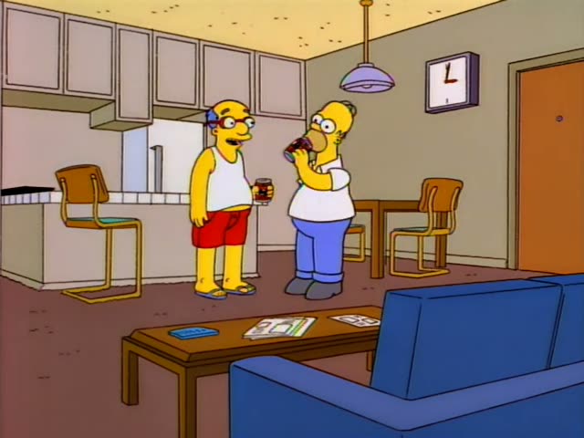 A bald, heavyset man in a white tank top, red shorts and flip-flops, wearing glasses, stands with a can in hand and Homer…