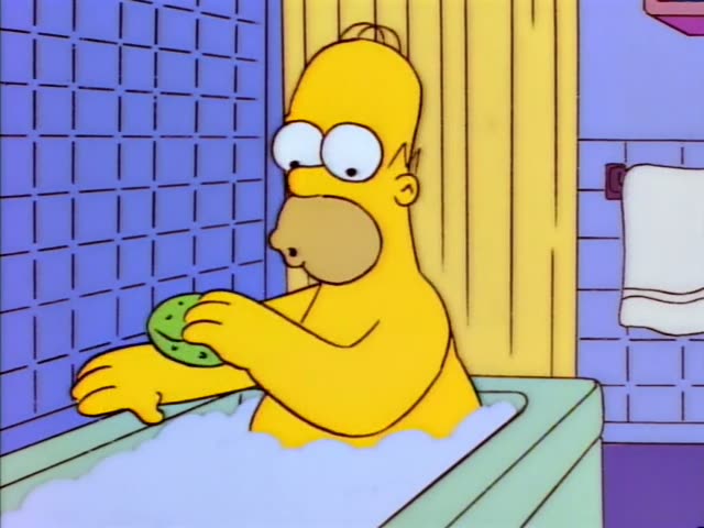 Homer sits in a bathtub full of suds in a blue-tiled bathroom, scrubbing his arm with a green sponge