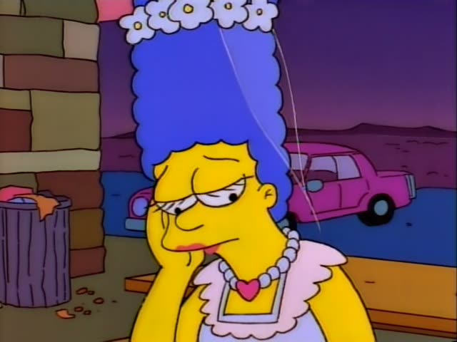Marge rests her cheek on her hand outside a brick wall beside a trash can while a pink car sits in the background