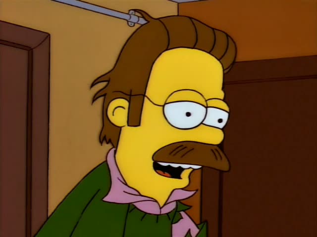 Ned Flanders is seen first in a close-up in a hallway, looking sideways with his eyes half-lidded and his mouth moving as he…