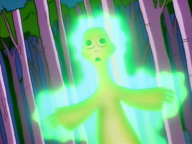 Homer, Marge with her tall blue beehive, Bart and Lisa stand together in a dark, purple-lit forest at night