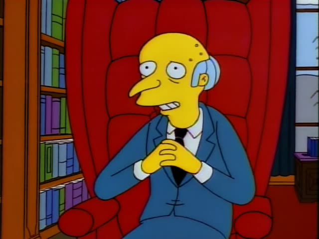 Mr. Burns sits in a tall red armchair with his fingers steepled, grinning, while Smithers stands beside him holding a brown…