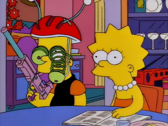 Lisa sits at a blue table beside a wacky Bart in a red helmet with green spiral goggles and a pink toy gun, who turns…