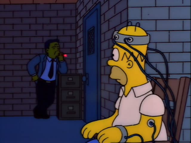 Homer sits in a brick basement room with a blue door and a filing cabinet