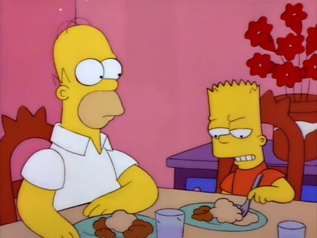 Homer and Bart sit at a dinner table with plates of meatballs and mashed potatoes in front of a pink wall and a vase of red…