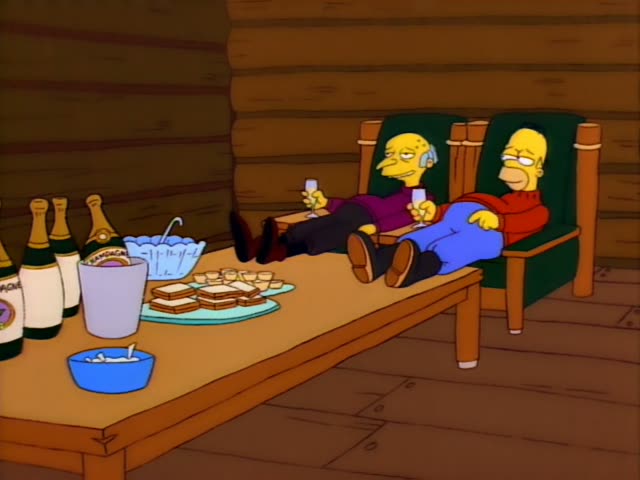 Mr. Burns and Homer recline with their feet up in green wooden armchairs inside a log cabin
