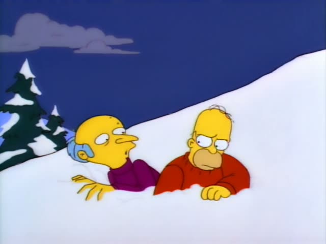 Mr. Burns and Homer are half-buried in snow at the top of a slope under a dark blue night sky with grey clouds…