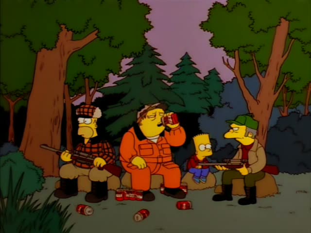 Four men and a spiky-haired boy sit on logs at a forest campsite, with the heavy man in an orange hunting suit and cap…