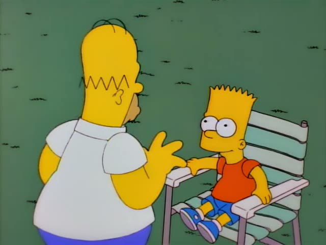 Homer and Bart sit on a green slatted bench on grass, with Homer gesturing as he talks while Bart looks up at him…