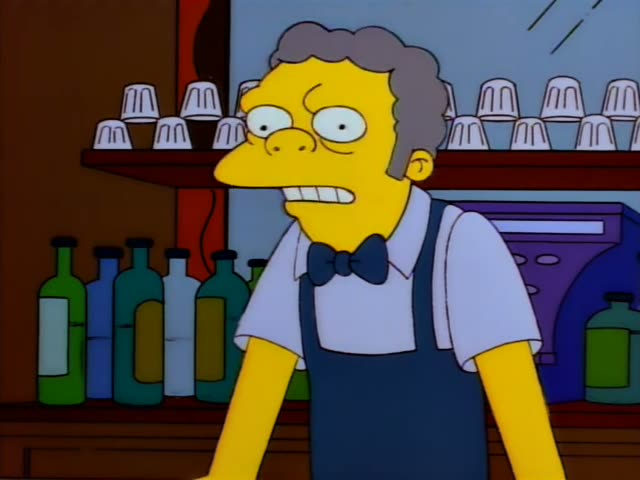 Moe stands behind the bar with his mouth open, first looking worried and then raising a finger and pointing