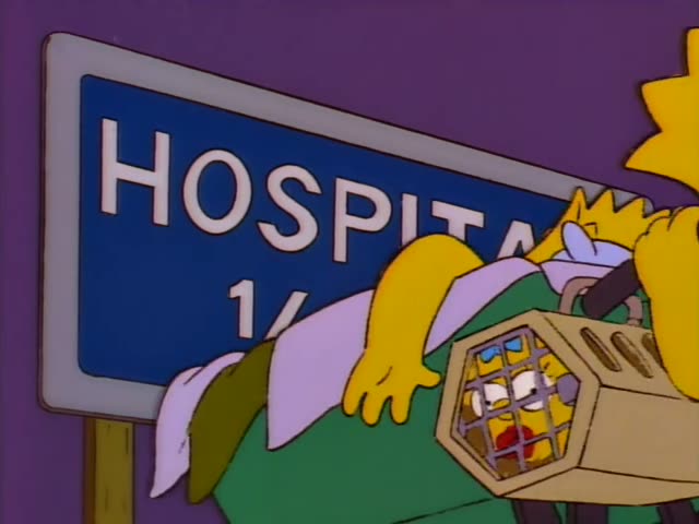 Lisa Simpson pulls a small wheeled cart carrying a cage of baby-like figures past a blue HOSPITAL sign reading 1/2 mi.…