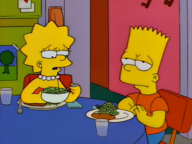 Lisa and Bart sit across a blue table in a kitchen with a green cabinet and pink wall behind them