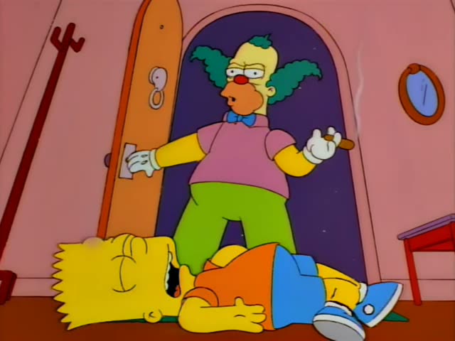 Krusty the clown, with green hair, a red nose, a blue bow tie and white gloves, stands in an arched doorway of a pink room…