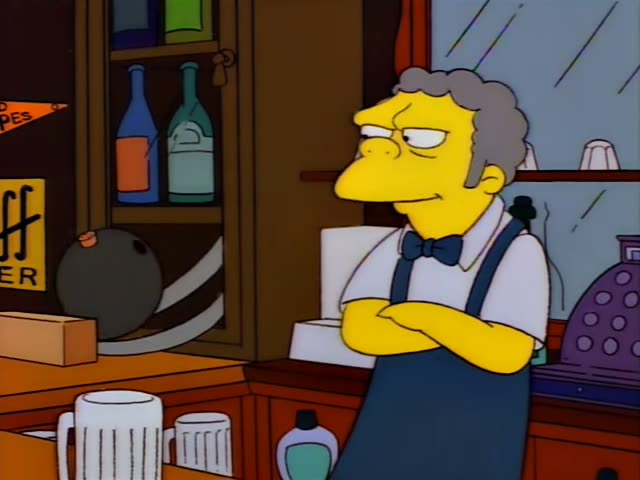 Moe stands behind the bar at his tavern, first with his arms crossed, then holding a dark pot and pouring its contents…