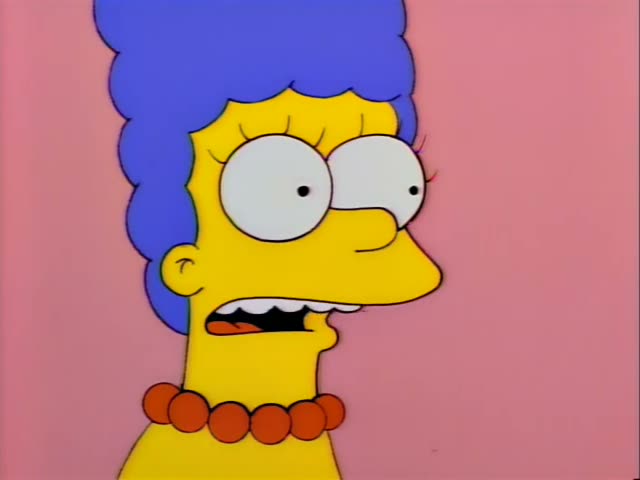 Marge Simpson first appears in a close-up with wide eyes and a clenched grimace, then speaks with her mouth open
