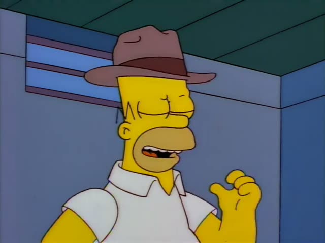 Homer stands in a storeroom with a dazed, eyes-closed expression and then looks on wide-eyed as Bart holds a black bowling…