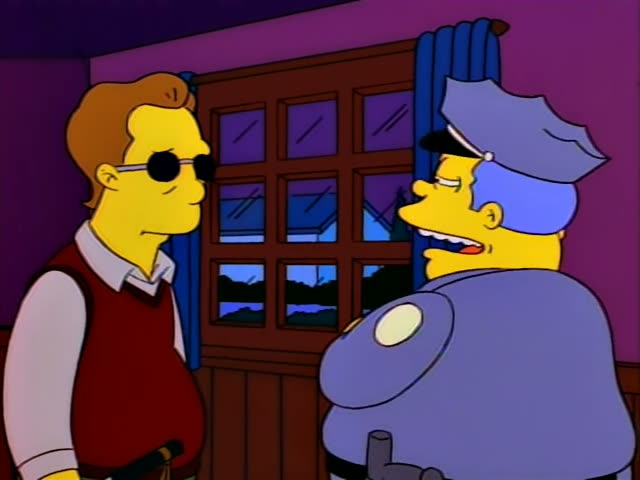 Troy McClure stands in a purple room beside a wooden-framed window with blue curtains while Chief Wiggum talks to him