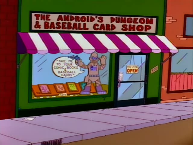 Bart browses the shelves of The Android's Dungeon & Baseball Card Shop, past a storefront with a robot figure in the window…