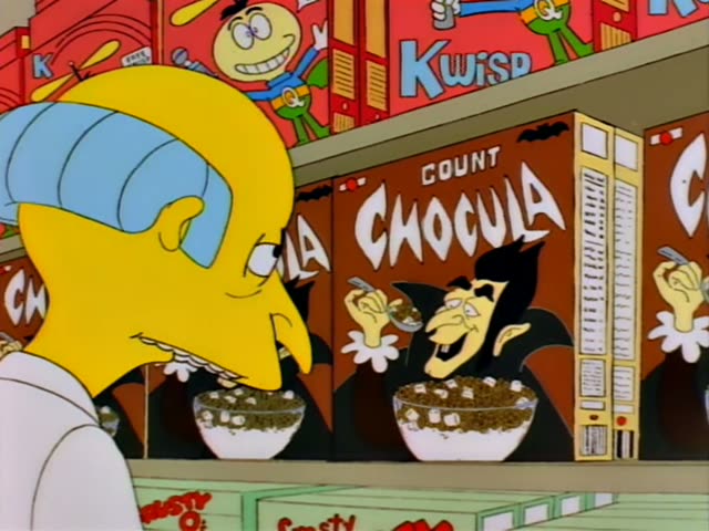 Mr. Burns stands in a store aisle beside shelves of Count Chocula and Kwisp cereal boxes, first leaning in with a sly grin…