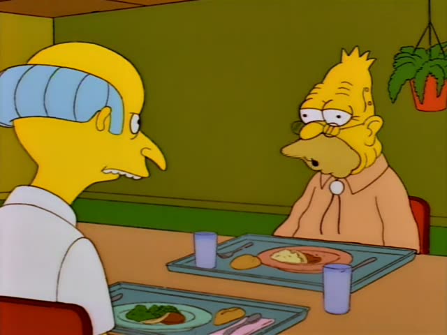 Mr. Burns sits at a table with Grampa and Grampa talks and points while Burns listens