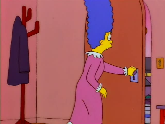 Marge Simpson stands in her house by a coat rack and an open front door, reaching for the door and then turning to face…
