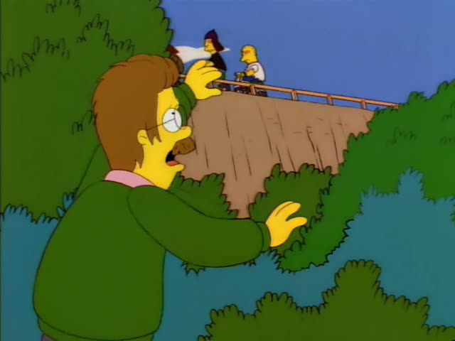 Ned Flanders stands before a dam and bushes with a hand pressed to his chest, then opens his mouth wide and raises both…