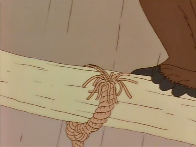 Ned Flanders dangles from a wooden ledge while a man in a pink shirt and blue tie, with dark swept-back hair, grips his hand…