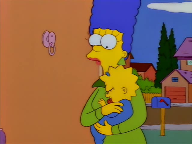 Marge holds baby Maggie in a green dress by the front door of the house in the first frames, then Homer in a white shirt…