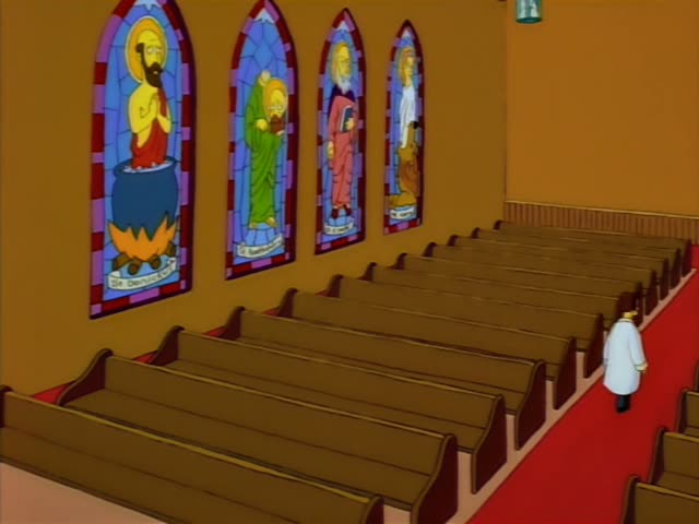 Marge Simpson is seated at a desk against a cinder-block wall beside a blue water cooler, first writing with a pencil…