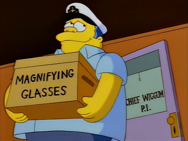 Chief Wiggum carries a cardboard box marked MAGNIFYING GLASSES past a door reading CHIEF WIGGUM P.I. Inside a dim orange…