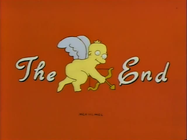 Troy McClure sits talking in an armchair across from Mr. Burns, a thin, grey-haired man in a lavender suit and red bow tie…